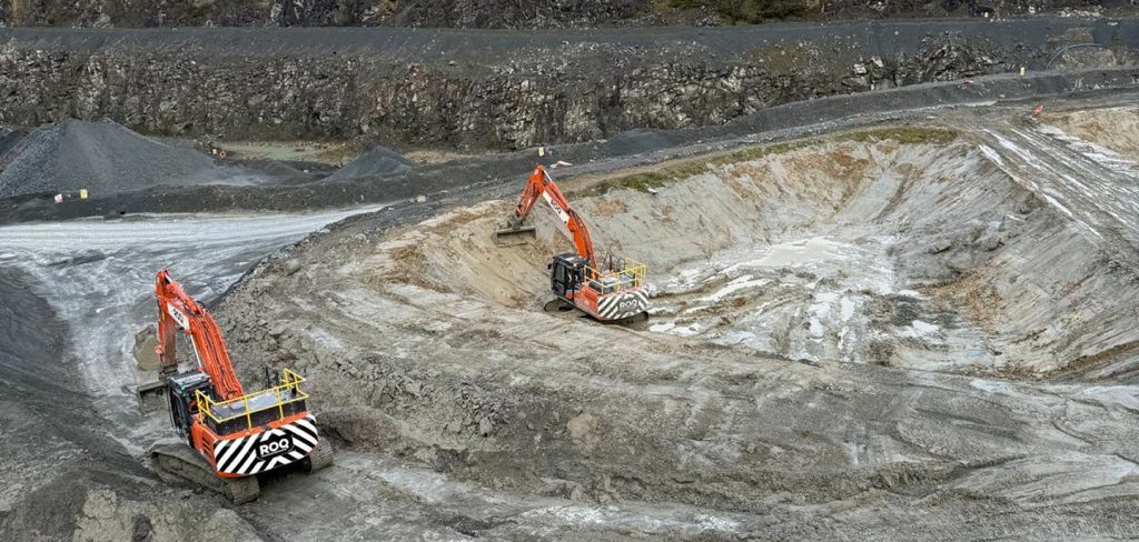 Two diggers working on pond infrastructure