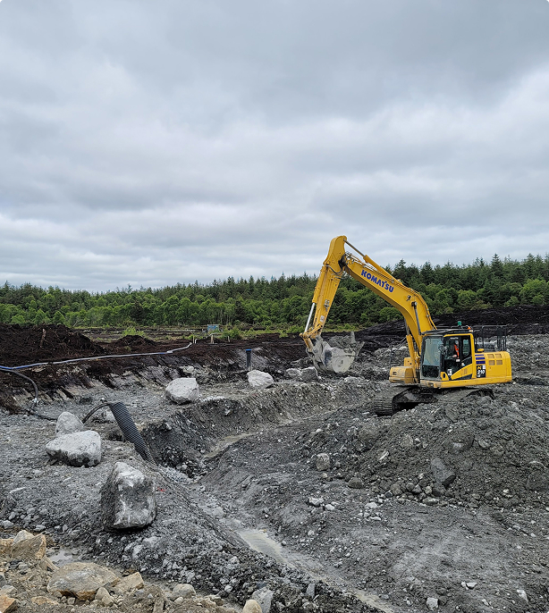 Yellow digger working on Derrinlough Wind Farm